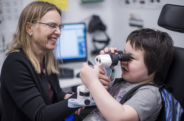 Pediatric ophthalmologist Dr. Jane Gardiner sees a patient at the DEEC.